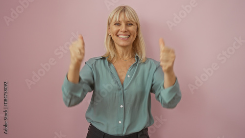 Wallpaper Mural Mature woman smiling with thumbs up over isolated pink background Torontodigital.ca
