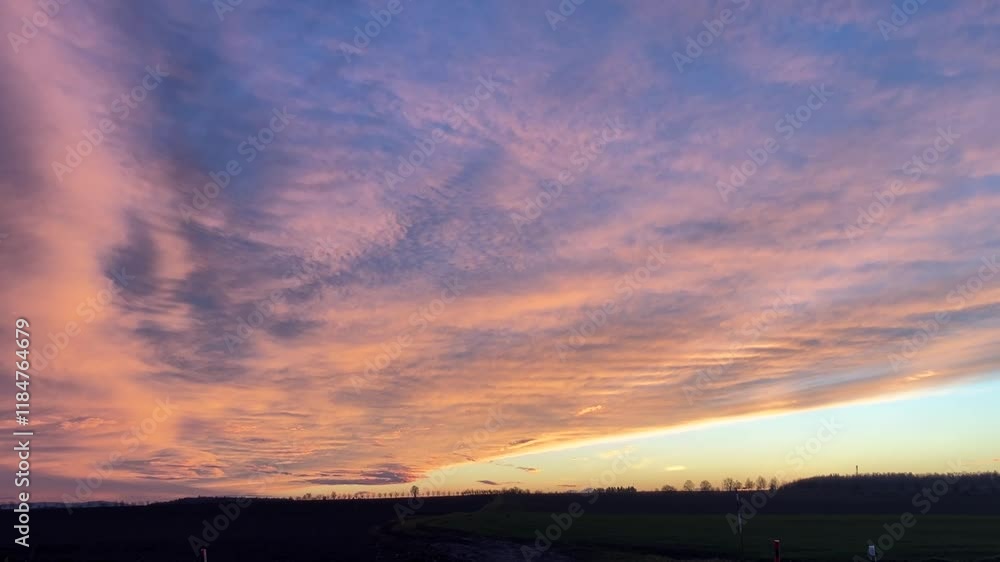 Vibrant Sunset Sky with Colorful Clouds, A stunning time-lapse of a colorful sunset sky, showcasing a breathtaking gradient of warm and cool hues. The clouds are painted in shades of orange, pink, Vibrant Sunset Sky with Colorful Clouds, A stunning time-lapse of a colorful sunset sky, showcasing a breathtaking gradient of warm and cool hues. The clouds are painted in shades of orange, pink,