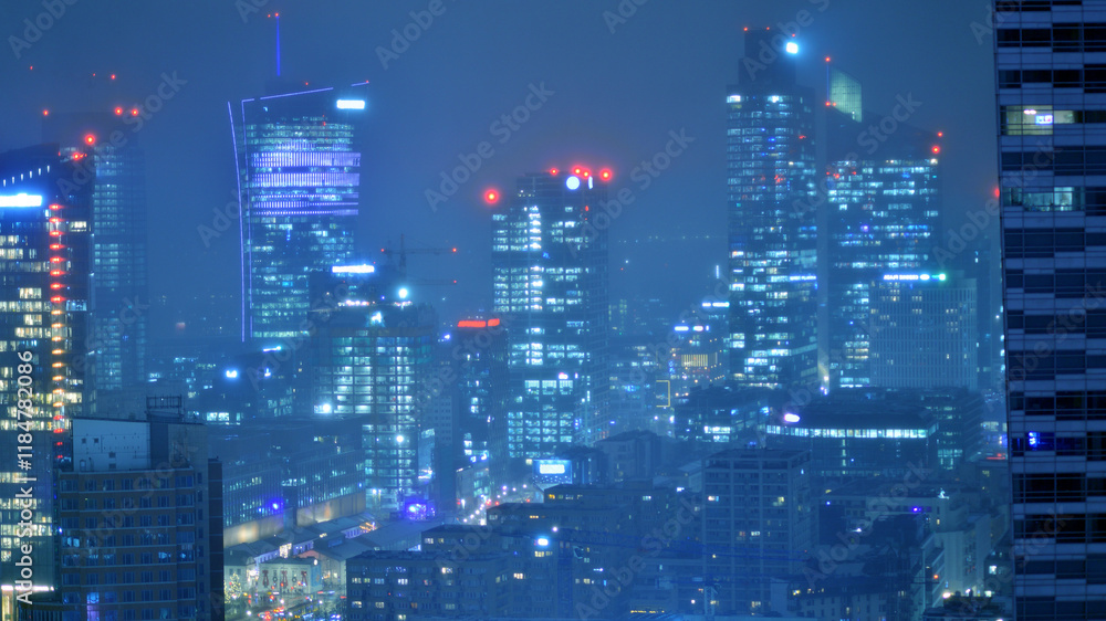 Aerial photography of modern architectural landscapes in the fog at night. Lights in the windows of buildings. The blue color of twilight. Aerial photography of modern architectural landscapes in the fog at night. Lights in the windows of buildings. The blue color of twilight.