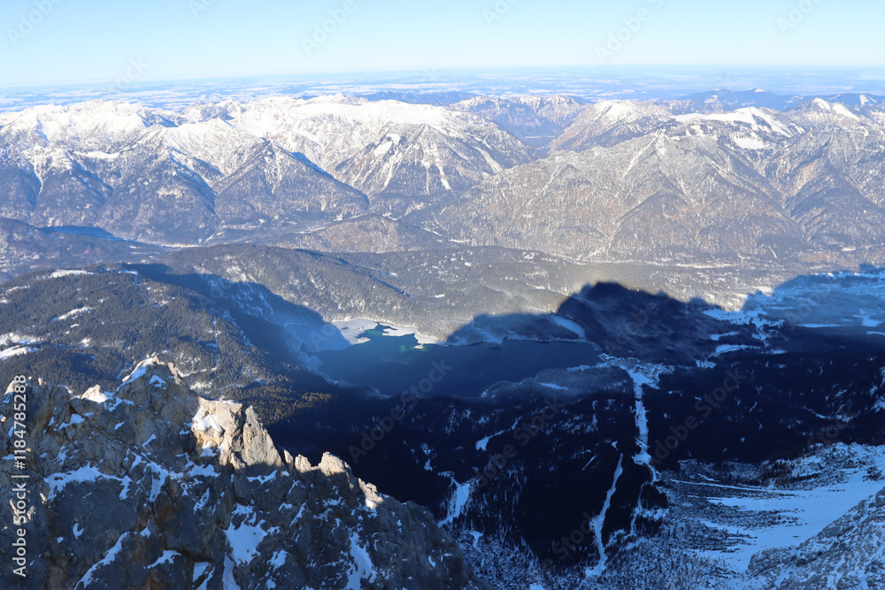 Obraz premium Shadow of Zugspitze over surrounding mountains