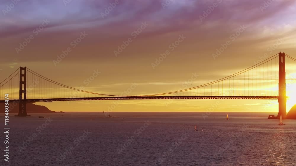 Golden Horizon: Aerial Shot of the Golden Gate Bridge at Sunset Over the Ocean
