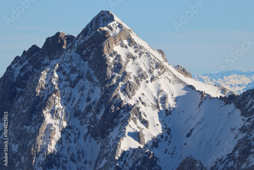 Beautiful close-up view of a mountain peak covered with snow photo