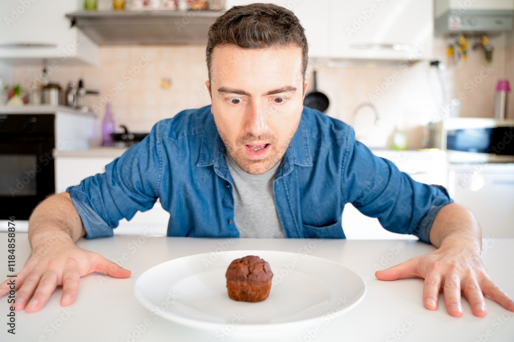 One man on diet tempted by chocolate sweet One man on diet tempted by chocolate sweet