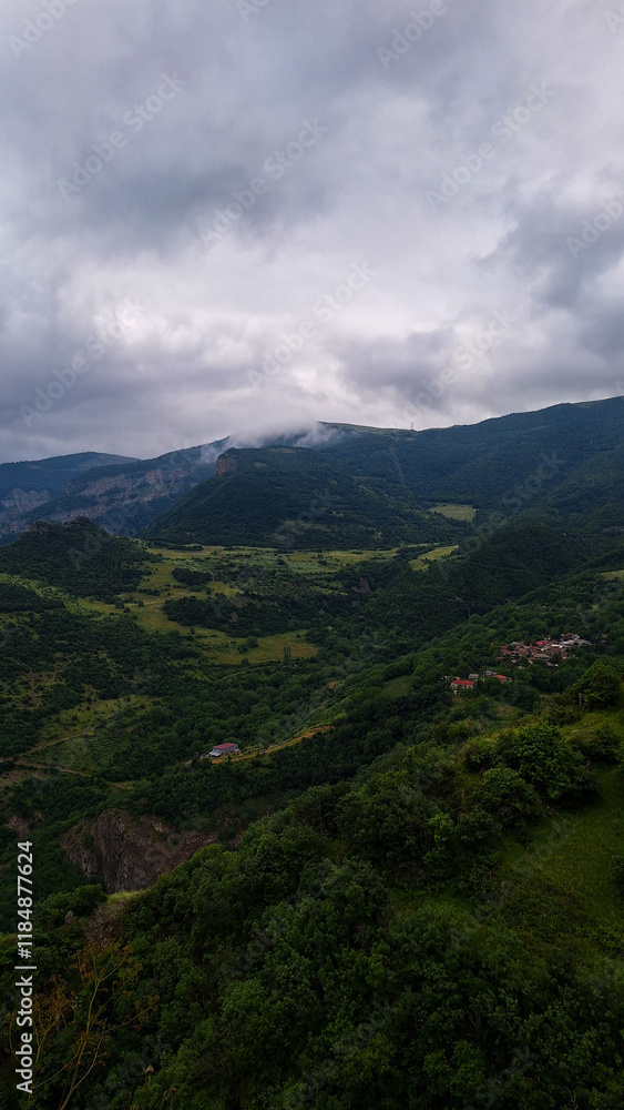 Foggy Mountain Valley with Dense Forest and Small Village Foggy Mountain Valley with Dense Forest and Small Village