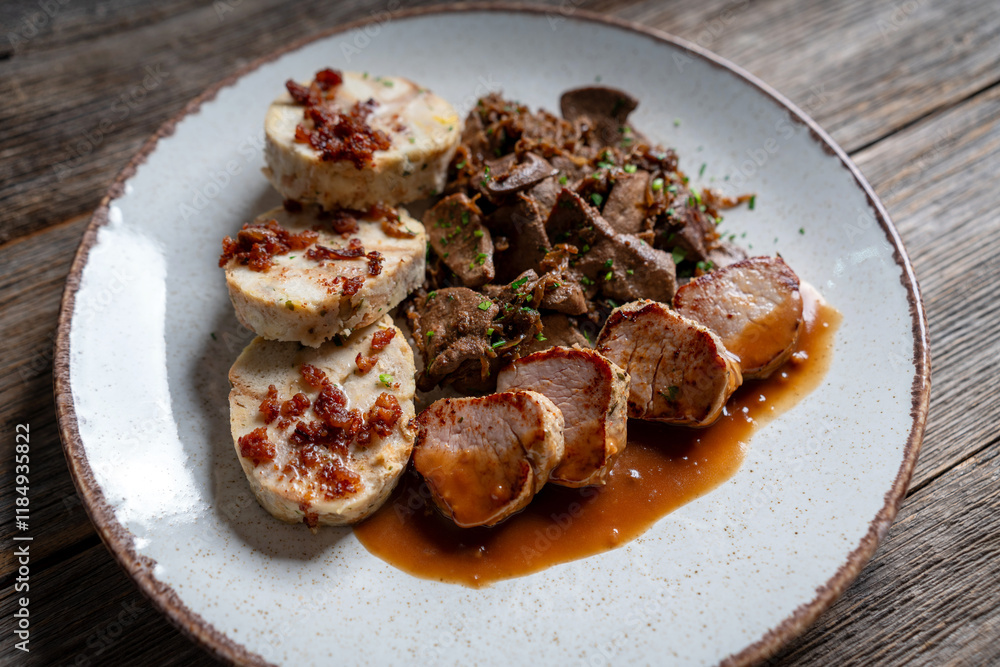 Sautéed Liver Served with a Bread Dumpling Topped with Crispy Pork Cracklings Sautéed Liver Served with a Bread Dumpling Topped with Crispy Pork Cracklings
