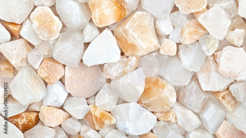 A close-up view of various small, irregularly shaped stones with a mix of white and light orange hues, creating a natural and textured surface.