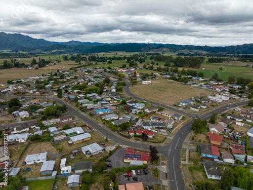 High-angle view of a residential neighborhood of Murupara. Homes of various colors and styles are nestled amongst streets and open spaces. MURUPARA, MURUPARA, BAY OF PLENTY, NEW ZEALAND photo