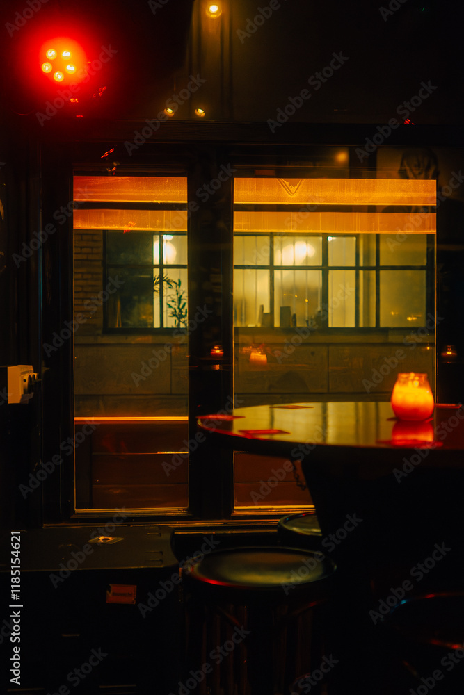 Cozy evening bar interior with dim lighting, glowing candles, and warm tones. Captures an intimate and inviting ambiance perfect for relaxation or nightlife themes.