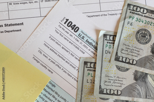 IRS 1040 and W-2 tax forms, close up, top down view  photo