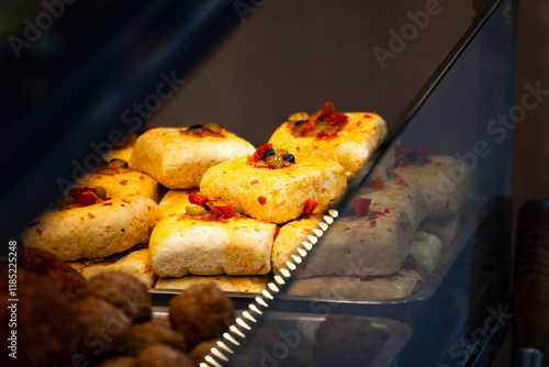 a street food stall where freshly prepared spicy stinky tofu is on display photo