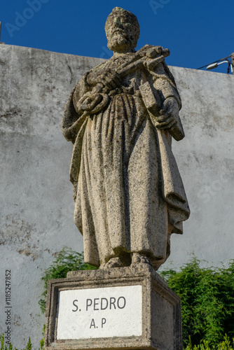 Stone statue depicting the S.Pedro belonging to the episcopal garden of the city of Castelo Branco-Portugal. photo