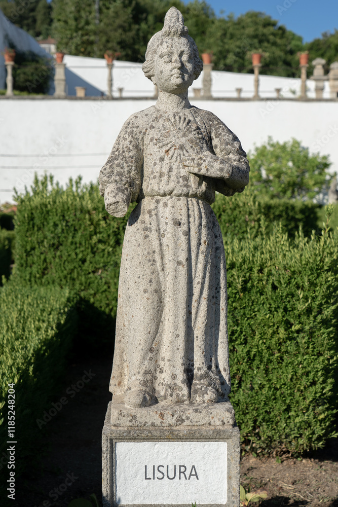 Obraz premium Stone statue Lisura the virgin sign belonging to the episcopal garden of the city of Castelo Branco-Portugal.