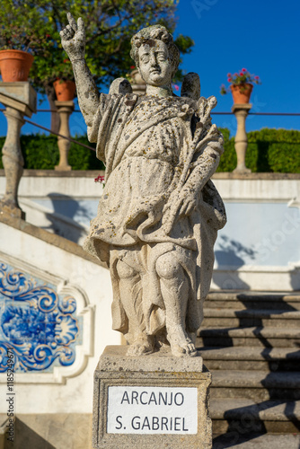 Stone statue depicting the Arcanjo S. Miguel belonging to the episcopal garden of the city of Castelo Branco-Portugal. photo