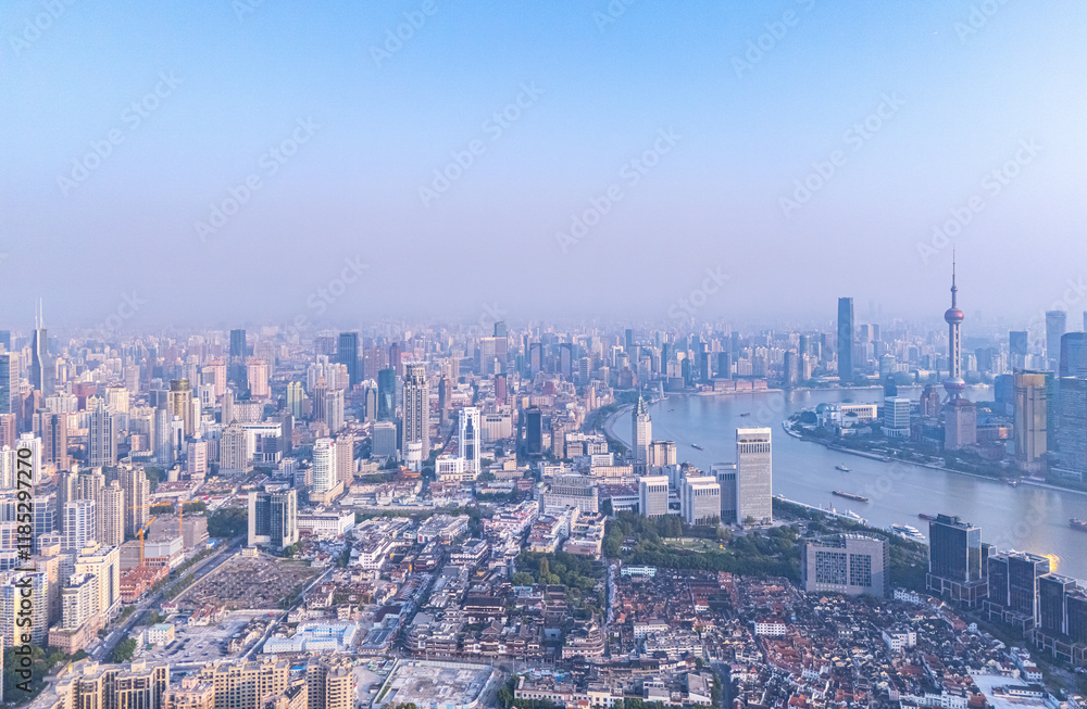 Fototapeta premium Aerial View of Shanghai skyline at sunrise with the Winding Huangpu River
