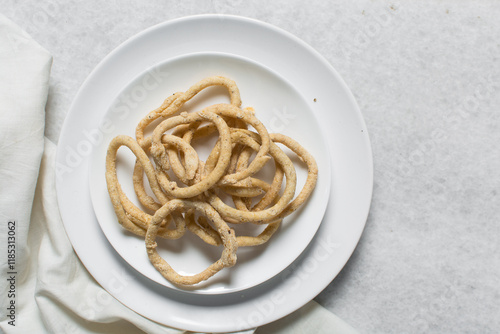 Top view of fried corn rings snack, Overhead view of nigerian kokoro egba corn snack photo