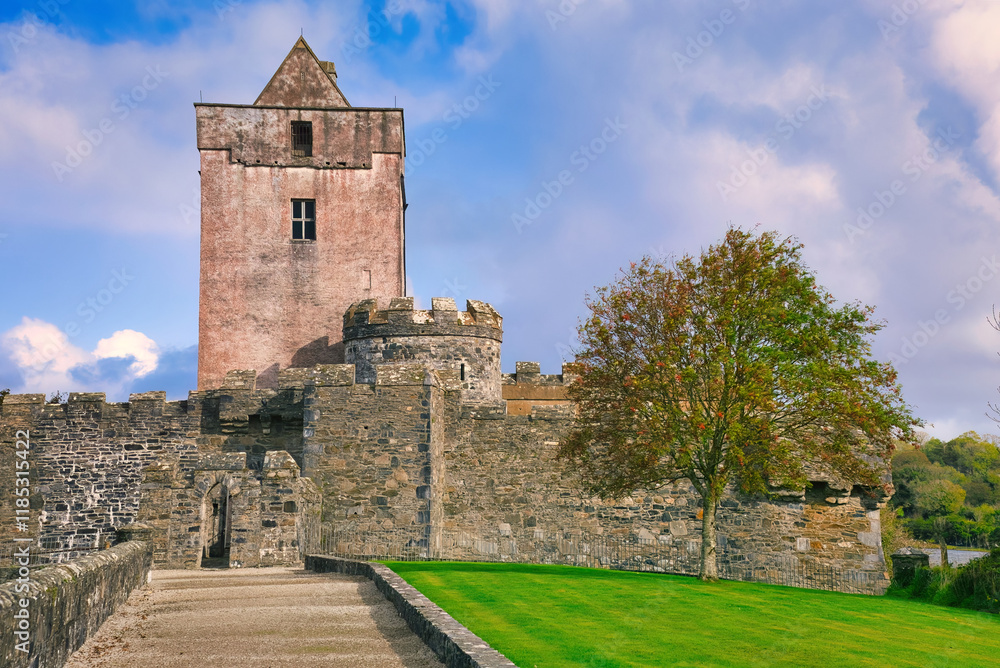 Doe Castle in Donegal Ireland - A breathtaking and picturesque view of a historic castle tower, beautifully nestled among lush green landscapes Doe Castle in Donegal Ireland - A breathtaking and picturesque view of a historic castle tower, beautifully nestled among lush green landscapes