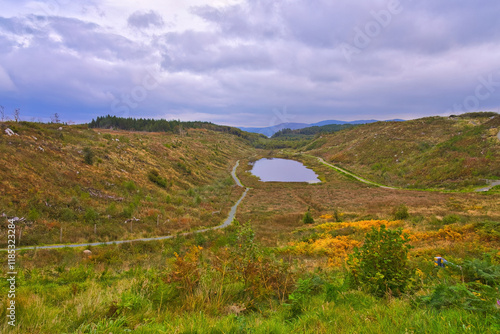 Cashelgolan Valley Ireland - This breathtaking aerial shot beautifully captures tranquil lakes surrounded by vibrant greenery and winding roads photo