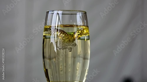 Two crystal flutes of bubbly champagne, a celebratory beverage, stand ready for a toast photo