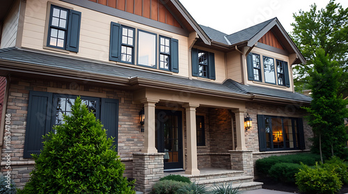 Wallpaper Mural Two-story house with beige siding, stone accents, dark window shutters, and a covered front porch. The landscaping includes small evergreen shrubs. Torontodigital.ca