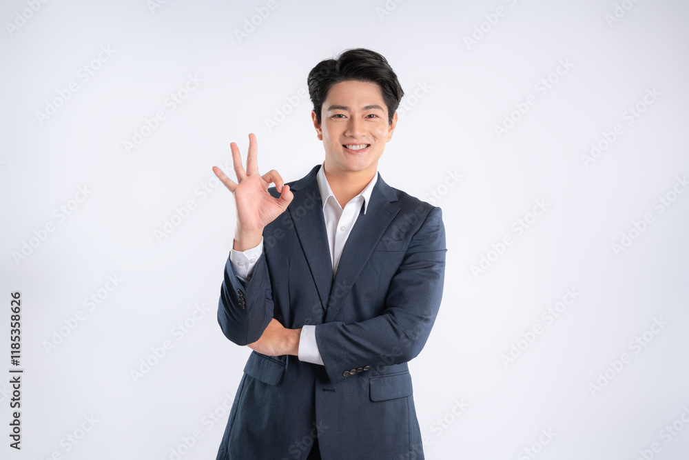 Portrait of young Asian business man posing on white background Portrait of young Asian business man posing on white background