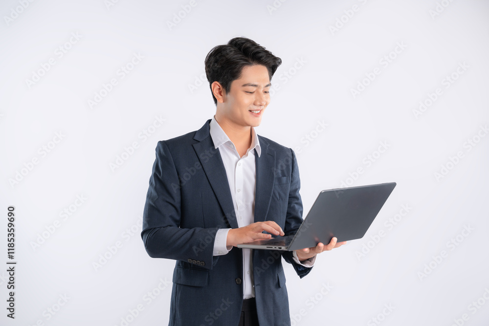 Portrait of young Asian business man using laptop and posing on white background Portrait of young Asian business man using laptop and posing on white background