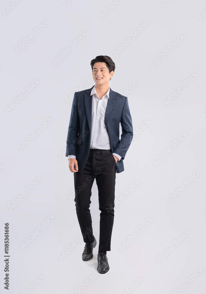 Full body image of a young Asian business man posing on a white background Full body image of a young Asian business man posing on a white background