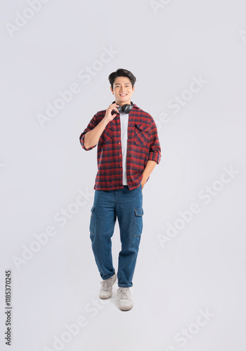 Full body image of young dynamic Asian man posing on white backgroundmage photo