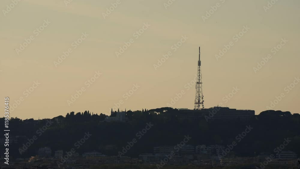 Telecommunications tower standing tall against a sunset sky in Rome, Italy Telecommunications tower standing tall against a sunset sky in Rome, Italy