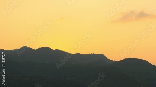 Landscape during sunset of mountains and sky. 4K 3840x2160, zoom out to wide shot. Can be establishing shot. Time lapse.