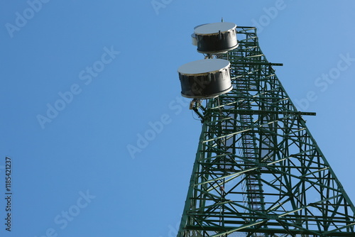 Communication tower top. Radio antenna Tower , microwave antenna tower on light sky background. wireless technology concept. communication