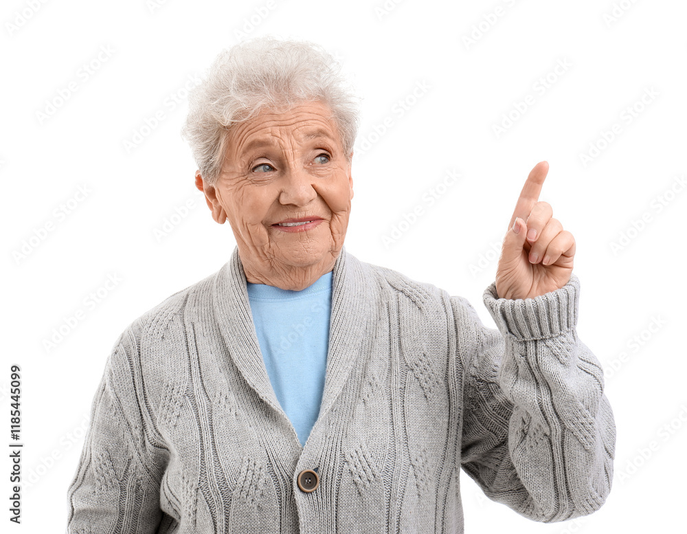 Senior woman pointing at something on white background Senior woman pointing at something on white background