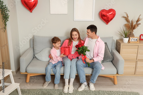 Little boy with gifts and h...