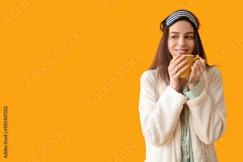 Young happy woman in pajama...