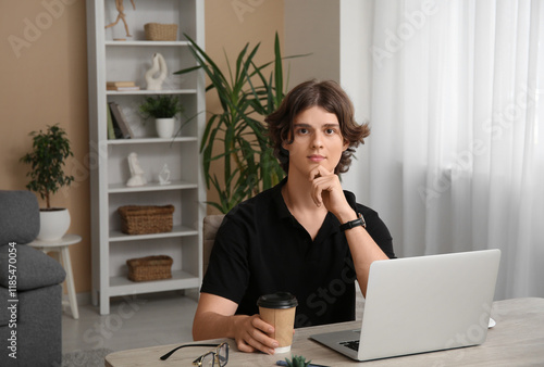 Male programmer sitting at ...