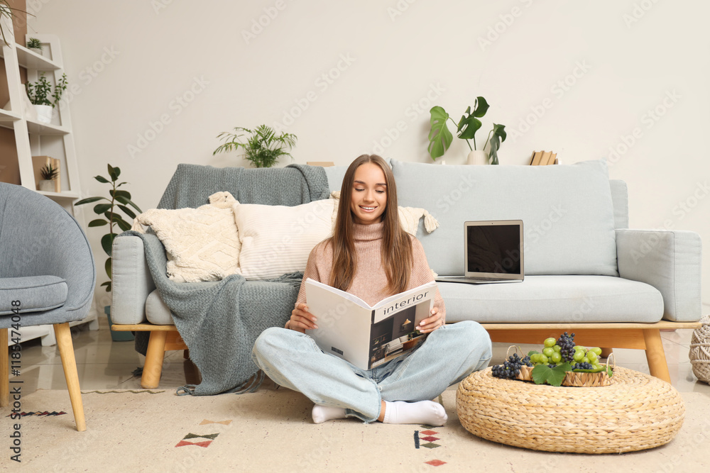 Young woman with grapes reading magazine at home Young woman with grapes reading magazine at home