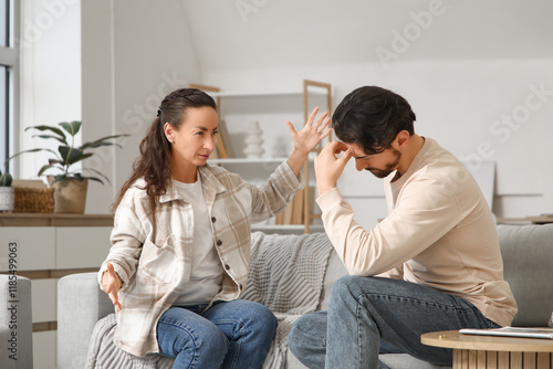 Unhappy man with his wife q...