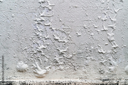 The blistered surface of cement wall. Swollen color wall from the moisture. Cracked wall, Paint white peeling off and old outside wall. Blistering occurs due to humidity, Wet wall surfaces and mold.