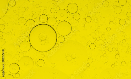 Macro microscope yellow bubble texture, Close-up Yellow bubbles and drops oil background . golden Yellow water bubbles, close up golden oil drop for celebration