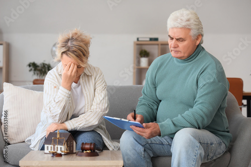 Mature couple signing divor...