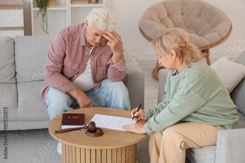 Mature couple signing divor...