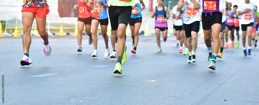 Fototapeta premium Marathon Running In The Light Of Morning, People Running On City Road Detail On Legs, Step, Walk And Outdoor Exercise Activities Concept.