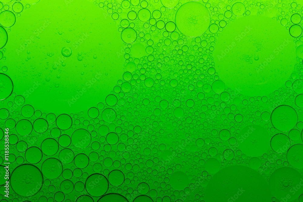 Macro microscope green bubble texture, Close-up Green bubbles and drops oil background . golden green water bubbles, close up golden oil drop for cosmetic Macro microscope green bubble texture, Close-up Green bubbles and drops oil background . golden green water bubbles, close up golden oil drop for cosmetic