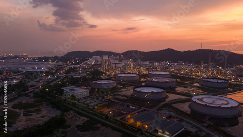 Oil Refinery plant at sunset. Gas Chemical Equipment Prodiction import export Concept, Crude Oil Refinery Plant Steel Pump Pipe line and Chimney and Cooling tower, Chemical Petrochemical photo