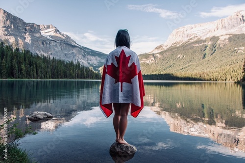 Standing in the beautiful Emerald Lake in Yoho National Park in British Columbia proudly wearing the Canadian flag