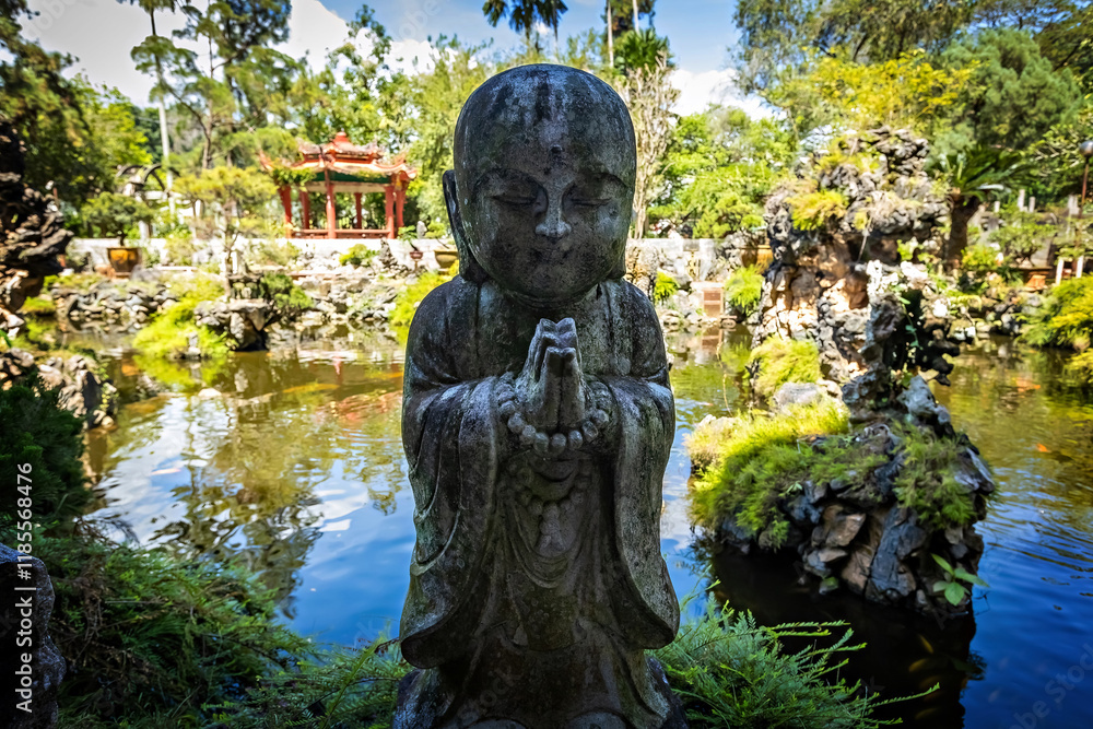 Fototapeta premium Stone Buddha statue in Perak Cave temple in Ipoh Malaysia