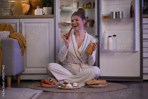 Hungry young woman eating d...