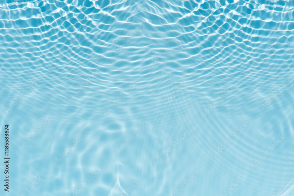 Blue water with ripples on the surface. Defocus blurred transparent blue colored clear calm water surface texture with splashes and bubbles. Water waves with shining pattern texture background. Blue water with ripples on the surface. Defocus blurred transparent blue colored clear calm water surface texture with splashes and bubbles. Water waves with shining pattern texture background.