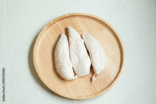 Three large pieces of freeze-dried chicken, preserved as pet snacks.