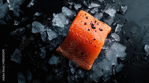 Fresh raw salmon fillet on crushed ice with black background highlighting rich colors and texture of the fish for culinary presentations photo