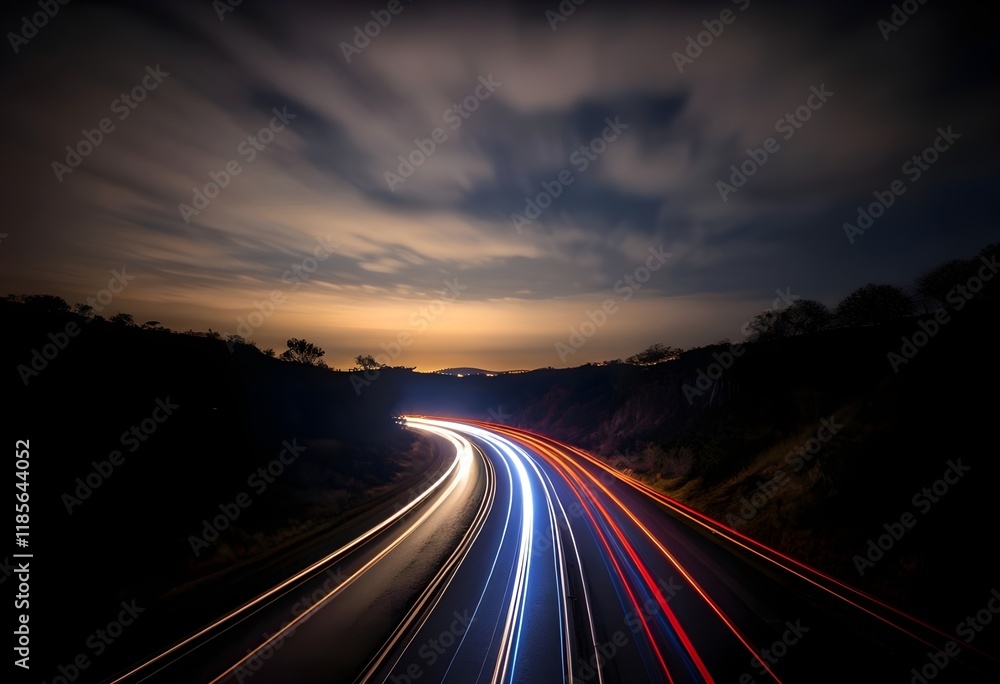 highway at night with long exposure light trails of red and white from vehicles, surrounded by a forested landscape under a deep blue sky with streaking clouds. highway at night with long exposure light trails of red and white from vehicles, surrounded by a forested landscape under a deep blue sky with streaking clouds.